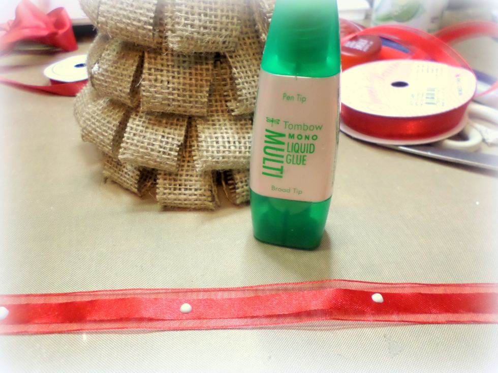 I decorated the tree with some ribbon. I used Tombow Mono Multi Adhesive because it becomes repositionable when it's dry. I'm always changing the placement of my ribbons and this glue lets me do that!