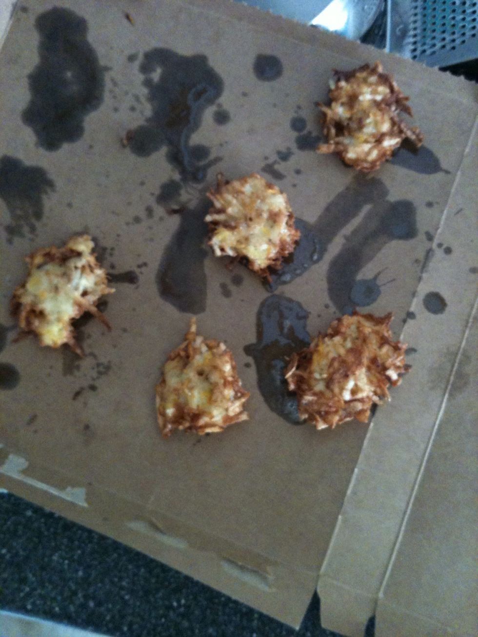 I discovered I had no paper towel to drain the tots so I McGuyvered a cardboard fish box into a grease soaker. Note: TP is never a good last minute blotting paper choice!