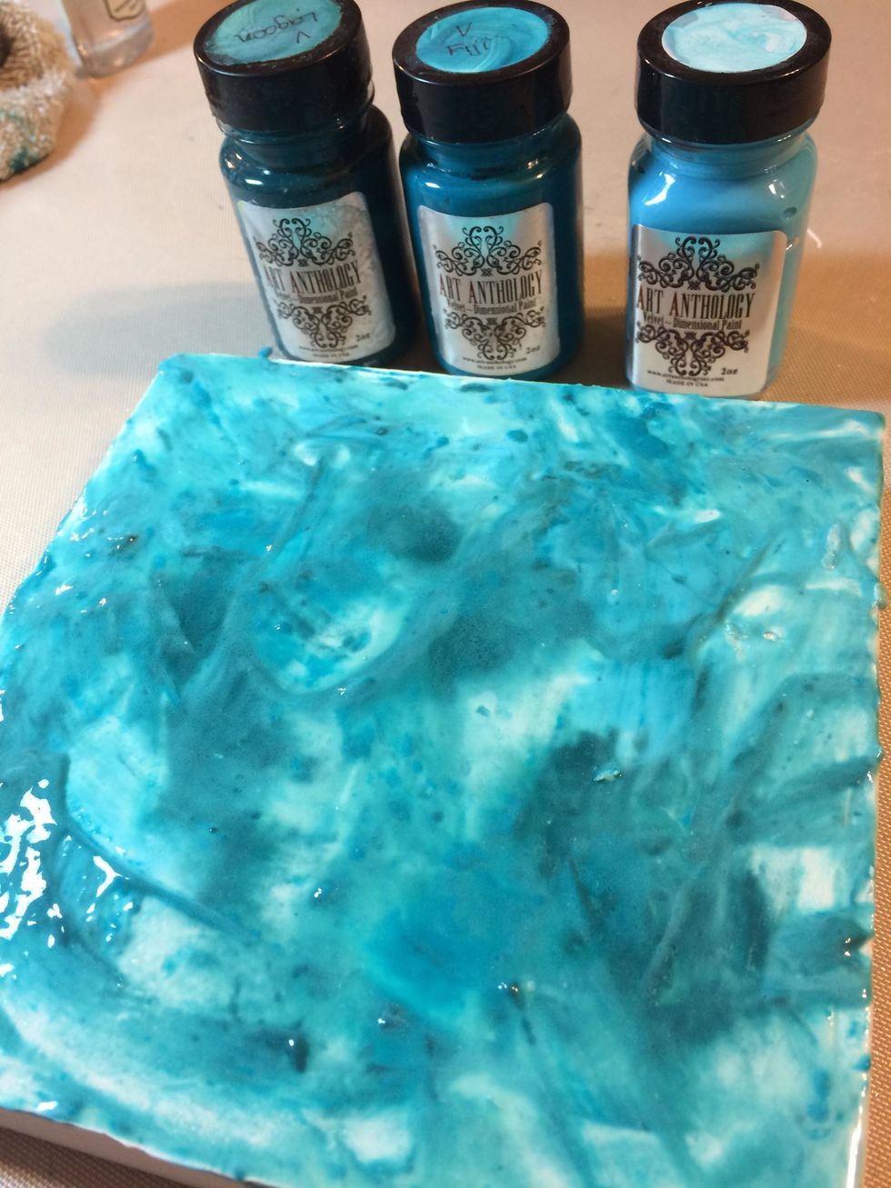 I dolloped some Lagoon, Fiji and Aloha Velvet onto the canvas then watered it down with a spray water bottle, slightly mixing colors.