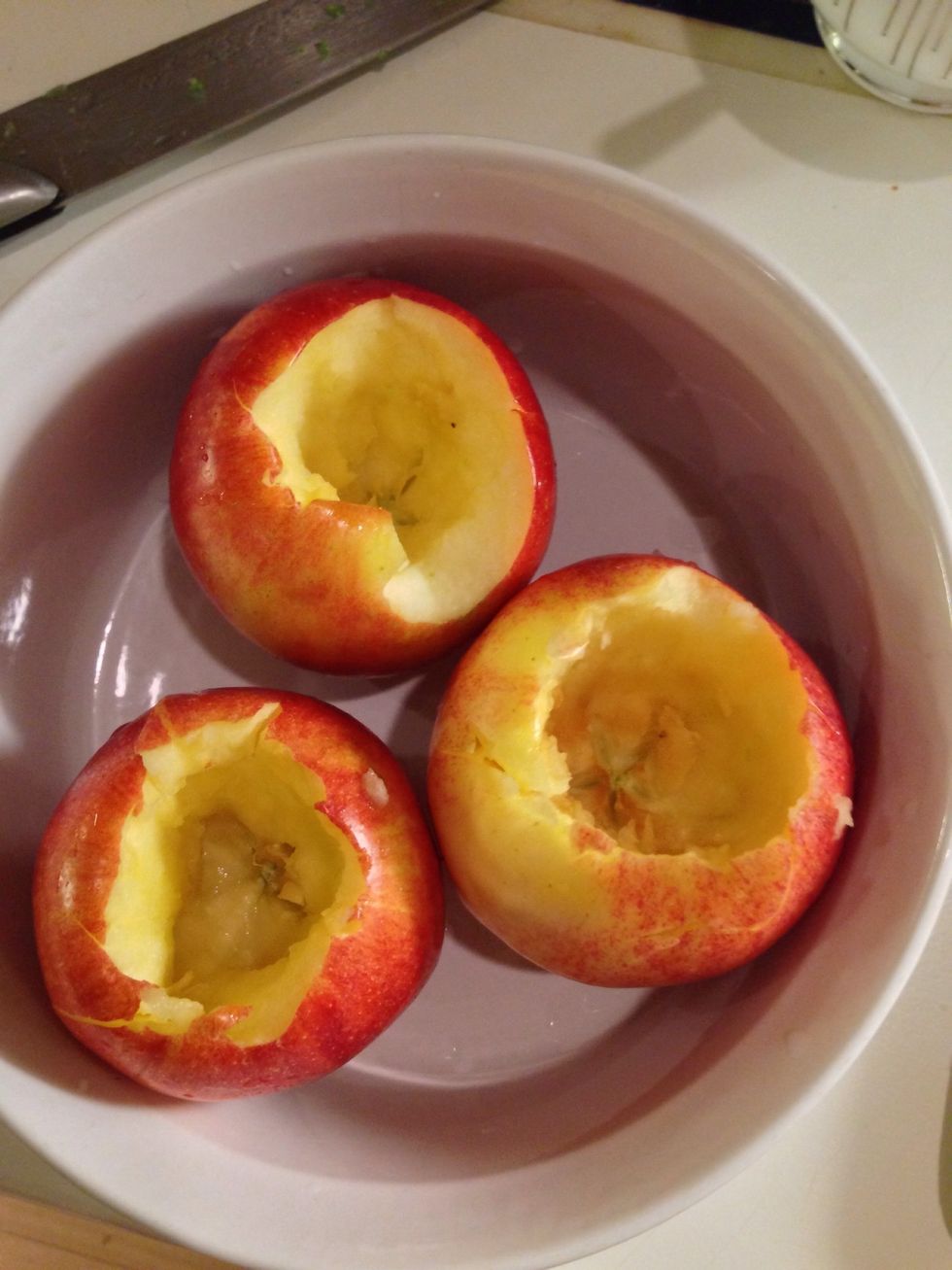 I don't have an apple corer, so I used a paring knife to cut out first the stem area, and then the core. Then I spooned out the seeds. I recommend making the holes about 3/4-inch to an inch wide.