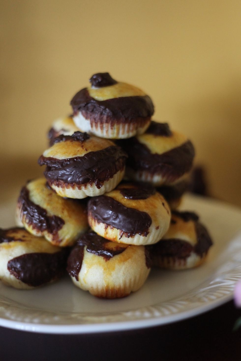 I don't know how or why, but my theory is that there are little pixies in my oven that cut each one open and decorates the outside with chocolate. They were not decorated by me, promise!