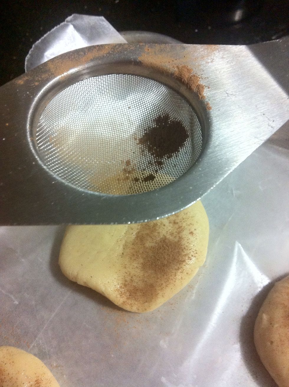I dusted the cinnamon on top of the cookies. After rolling about 1 inch balls, I pressed them down with a glass cup.