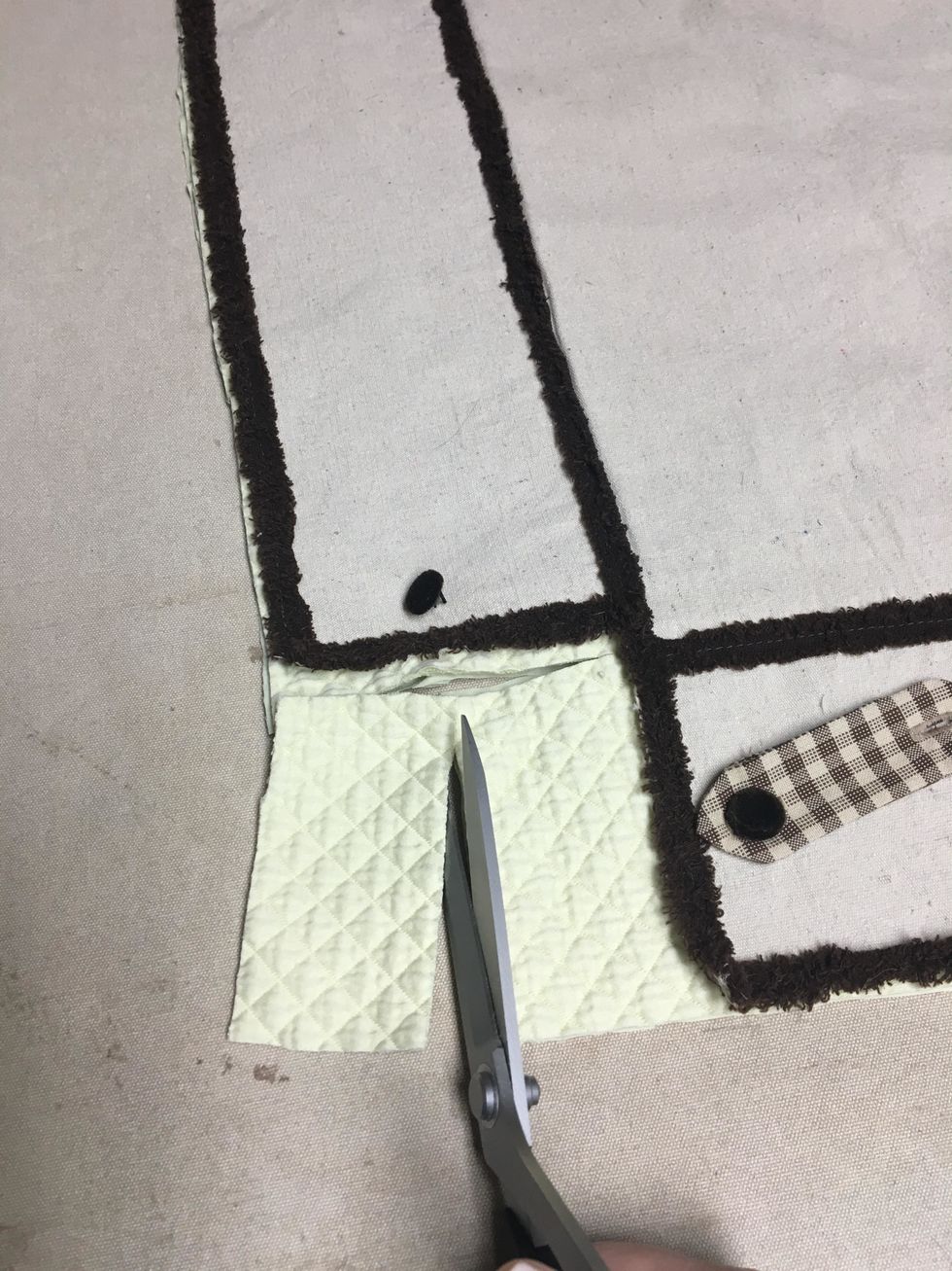 I ended up trimming it down to   be about 2" wider than the finished width of the side flap/drop.  If you chair has larger legs you won't need to trim as much away.  Trim too much and its ruined!