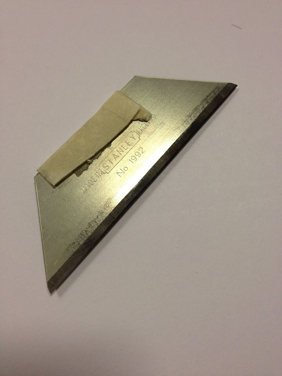 I fashioned a handle of masking tape on the stanly blade to reduce stress on fingers