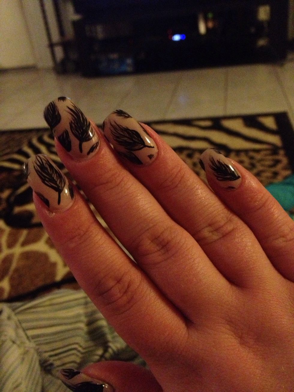 I filled in the empty spaces with light brush strikes to resemble pieces of feathers.