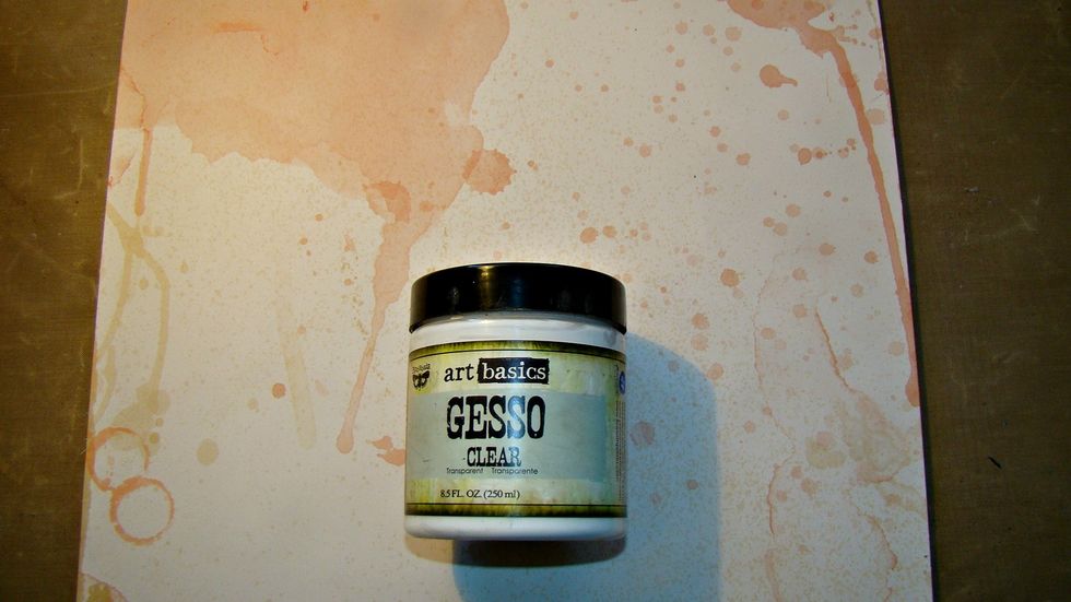 I first coated the paper with clear gesso, this provides a primer for my paper and it's clear so it doesn't cover up the pretty splatters that were already on the paper. Allow to dry.