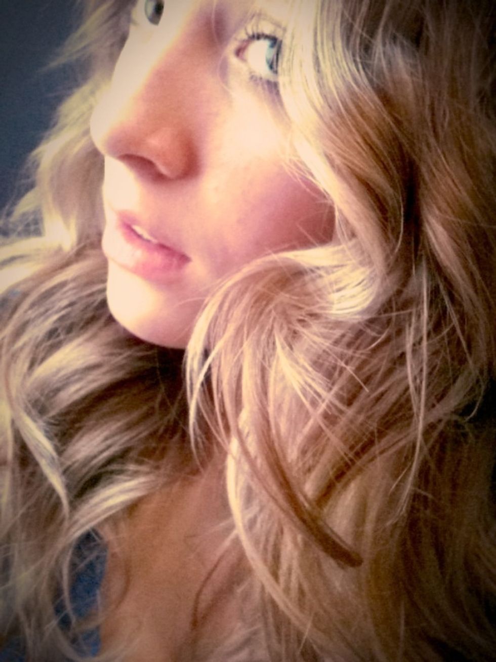 I flip my head and hair around and spray it a couple times with pump hairspray, just to set the curls and loosen them up a bit....