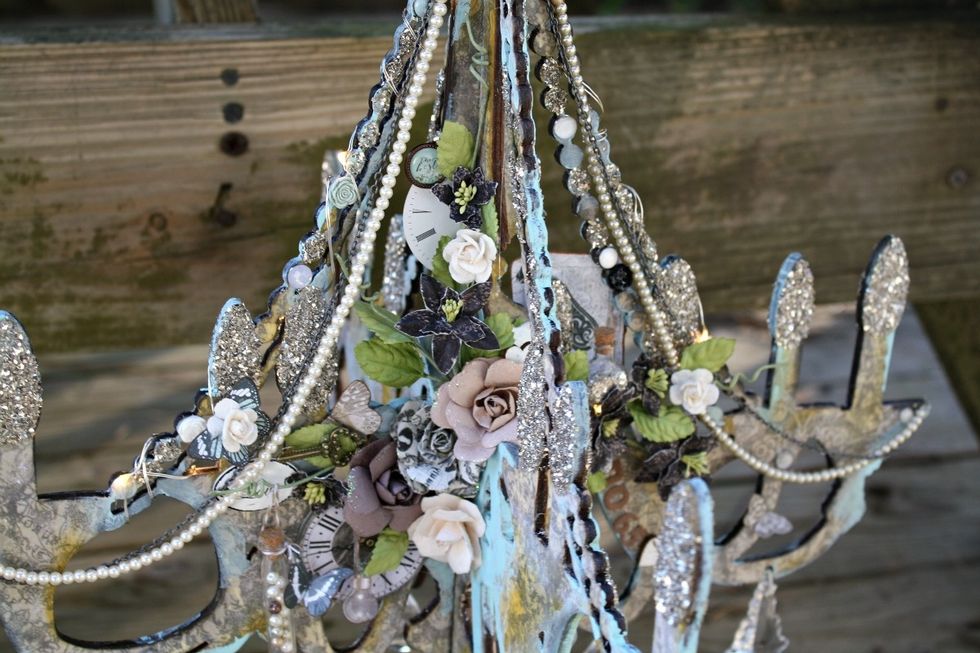 I forgot to photograph, but I added more of the glass glitter to that "beaded" area on the chandelier too. It really highlights it well. And the Lumies are so pretty lit up in there!