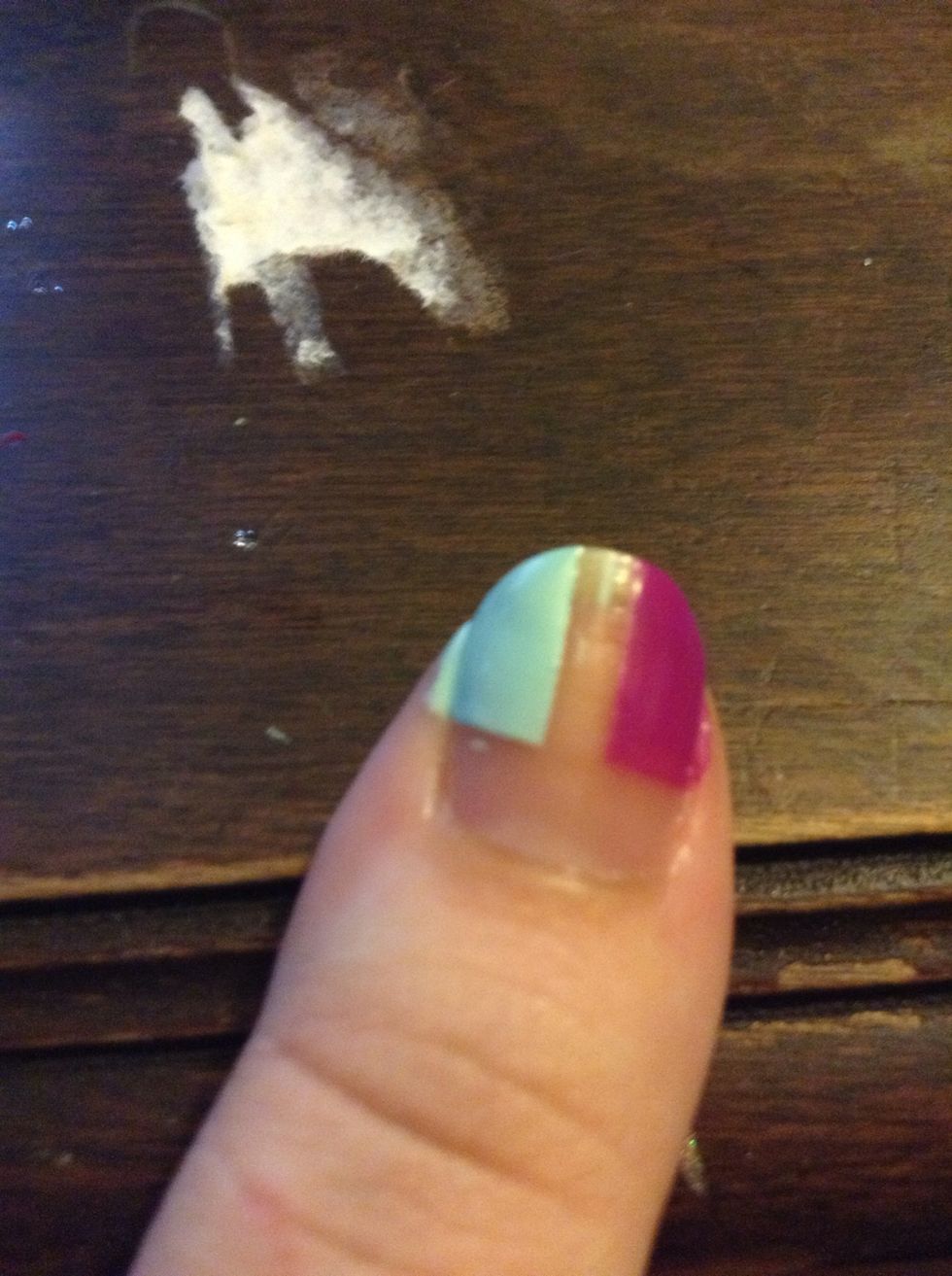 I forgot to take a pic of the tape, but tape off the top part of your nail and make a space in the other half of your nail, and paint it like this.
