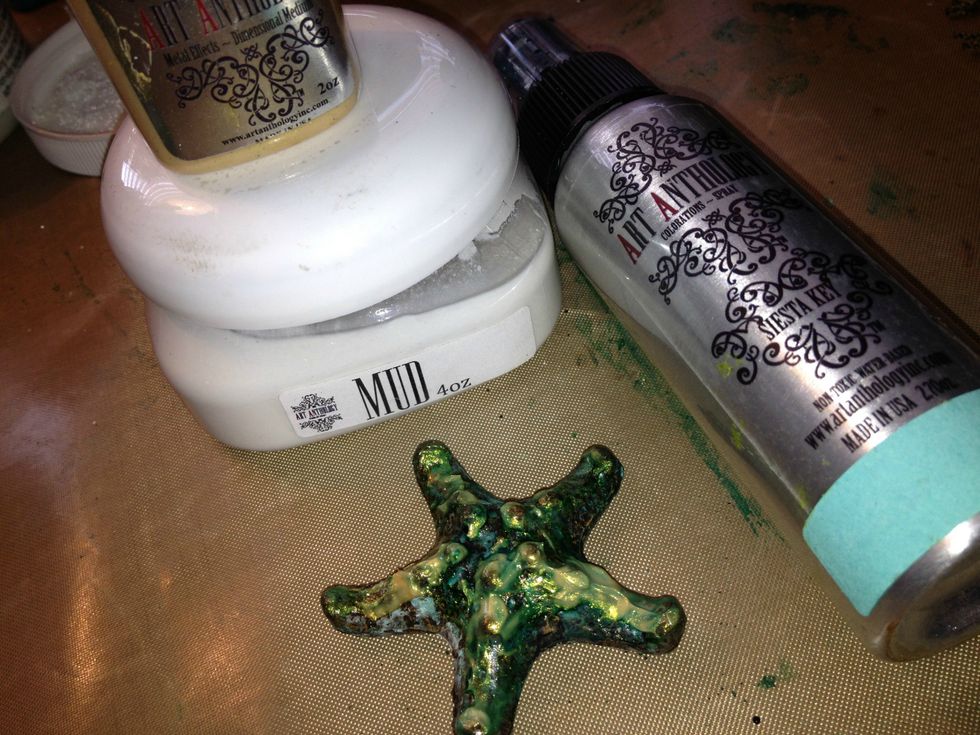 I forgot to take a pic of this chipboard starfish, but I applied gobs of Mud Texture Paste and allowed to dry, then using a glue gun I applied beads of glue to the top. Then gesso it.