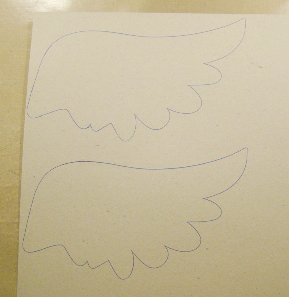 I found a wing on the internet and drew them out on chipboard then cut them out.