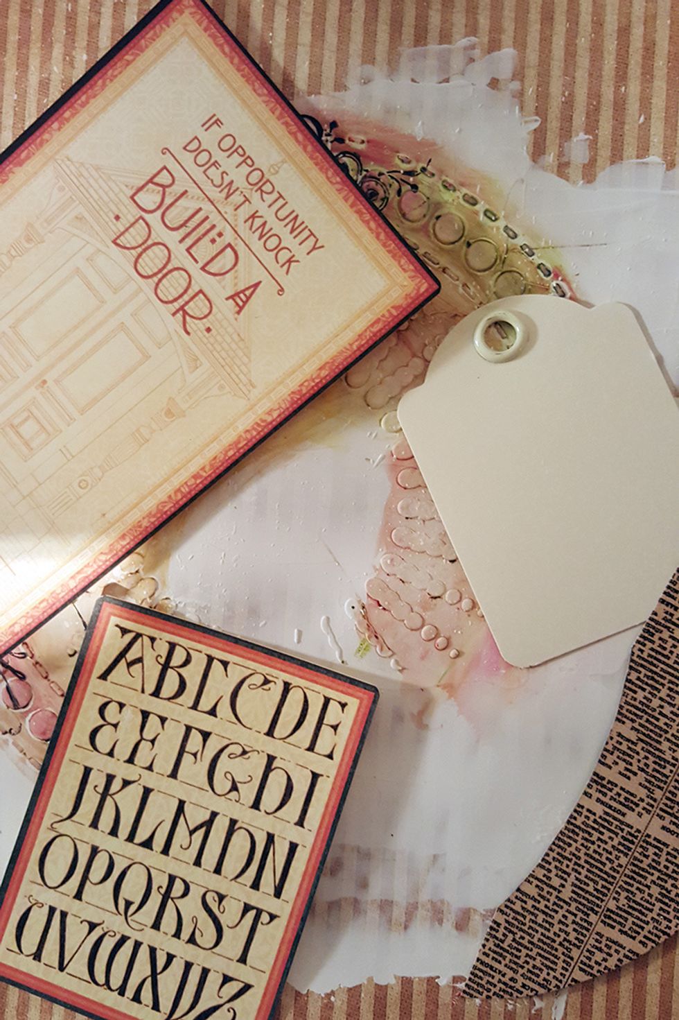 I found some cards from Graphic45 and a tag that I will use to "build" the background.