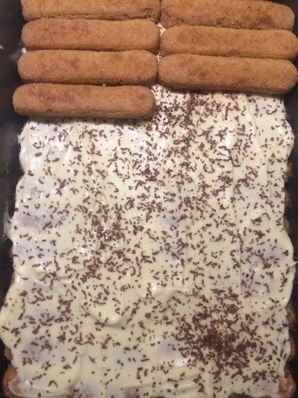 I found some dark chocolate bars and decided to use them as shavings on the first ladyfingers layer for some added chocolate taste. Add another coffee dipped layer of ladyfingers on top.