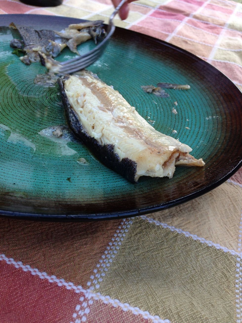 I found that although they usually say to cook them longer, fish is much much more tender if you cook it 10-15 min. The skin should easily slide off.