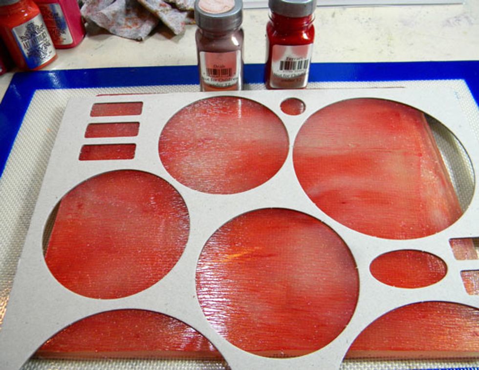 I found this chipboard piece that I thought would be fun to use. I spread Ferrari and Drab Sorbets on the plate then placed the chipboard on top.