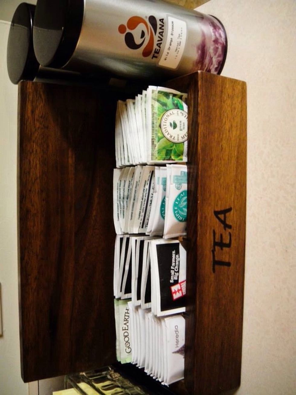 I found this tea box in World Market but my friend made it from husband's wooden cigar box. You also can find an unfinished wood box in Michaels.