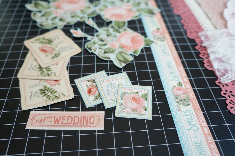 I fussy cut flowers and elements from the Time to Flourish and Botanical Tea papers to add to the page...