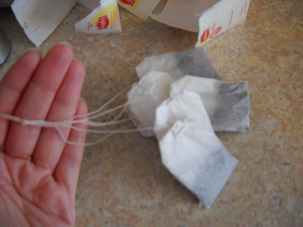 I gather all the bags together and tie a knot in the strings, somewhere near the end. This is not necessary but it makes it easier to pull the bags out of the water together.