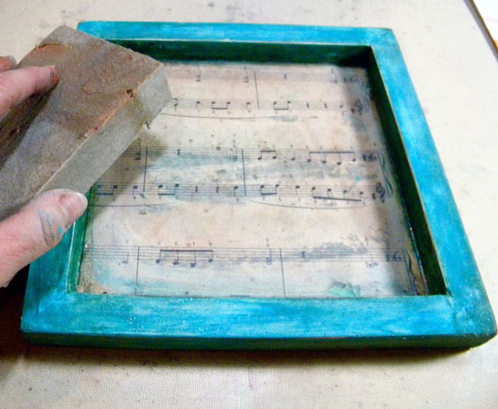 I gave each canvas another light sanding.