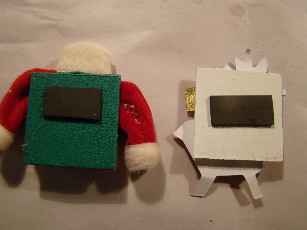 I gave each wooden square a coat of acrylic paint and then embellished. Flip over and glue magnet on the back.