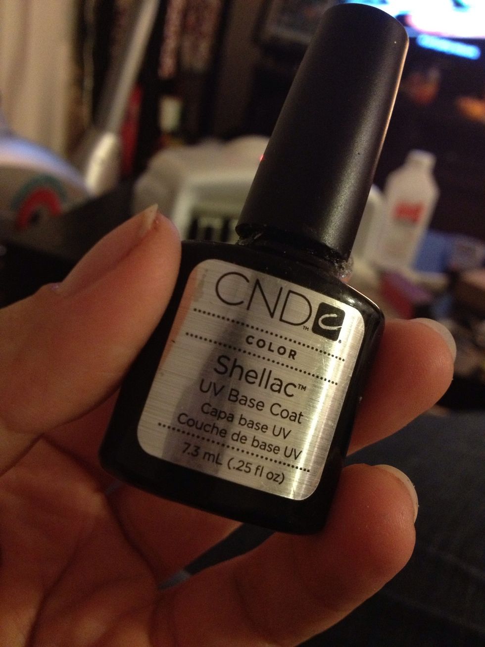 I give myself a manicure and file my nails to my liking. Wash your hands clean. The process is simple: Base coat, color, top coat. Each layer gets 2 minutes under the light. First- base coat.