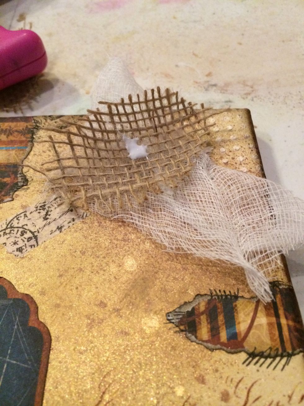 I glued a piece of cheesecloth and burlap to the top right corner of the canvas.