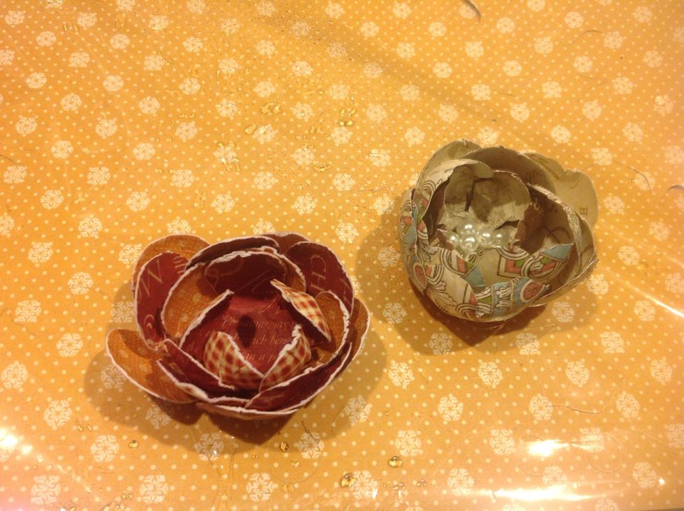 I glued all my layers together and TA da. I added some glue to the center and dropped some pearls in. You can add buttons or anything you like,  quick and easy flowers!