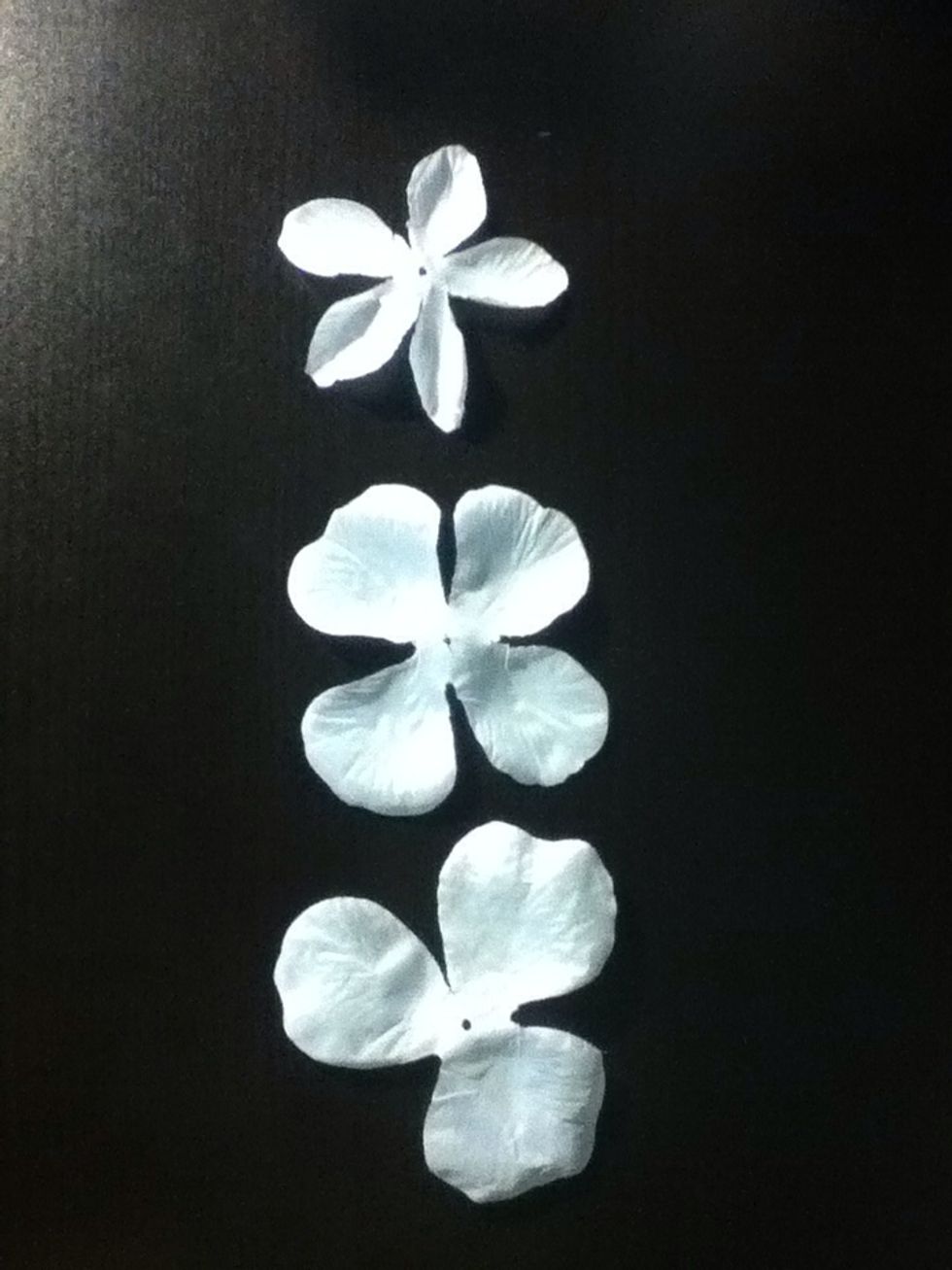 I got a few sets of fake flowers from the dollar store and separated out the petals