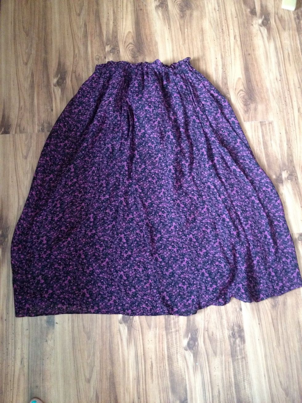 I got a thrifted skirt. It's got a sheer layer over the polyester liner.I first measured how high in front and how low in the back I want it to sit, by trying it on and measuring. Flip inside out .