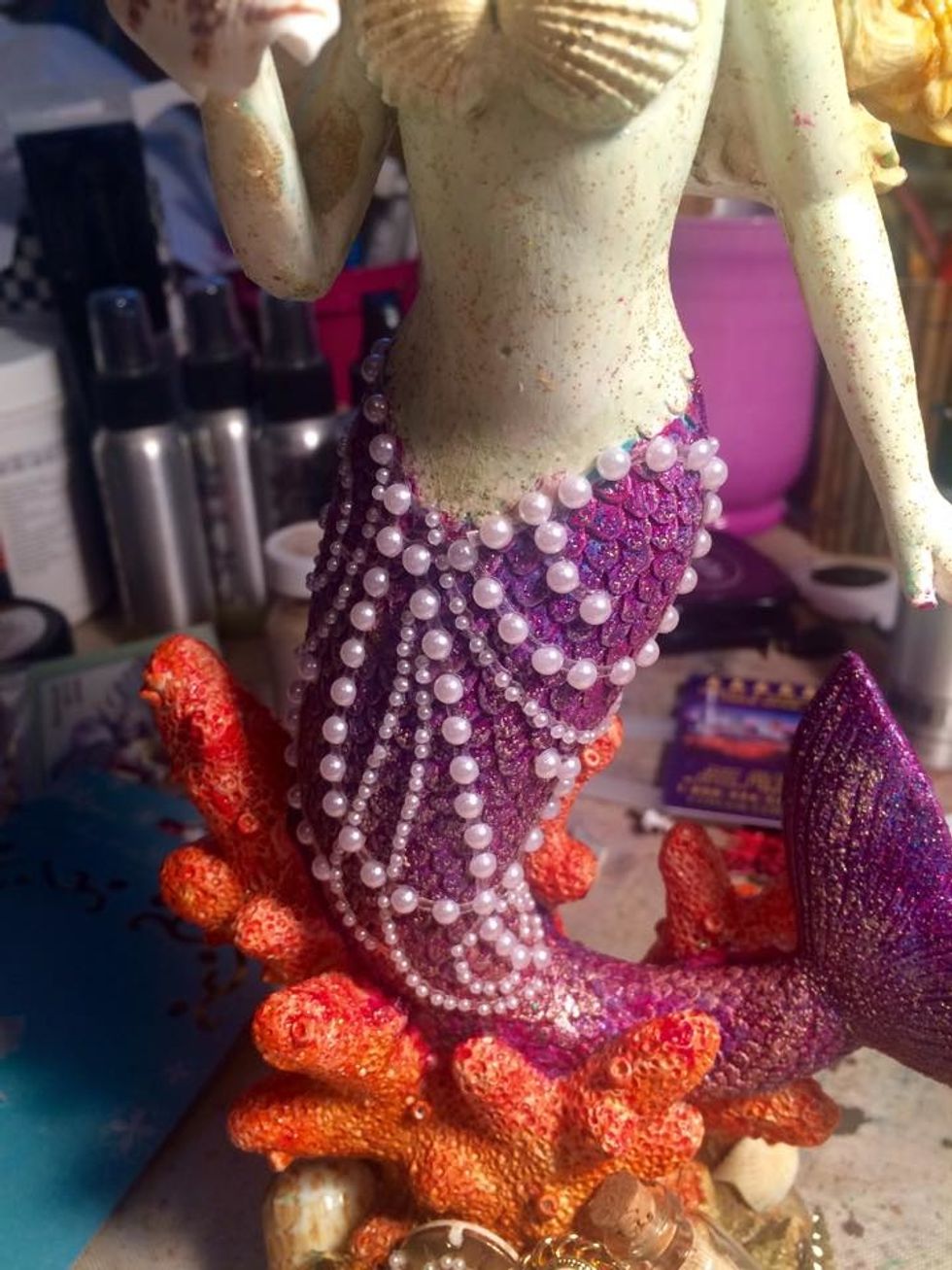 I got out my Prima Pearls and applied them to her body. I love that they are sticky so they laid right on her nicely. I only had to cut a couple of pieces away for it to fit around her waist.