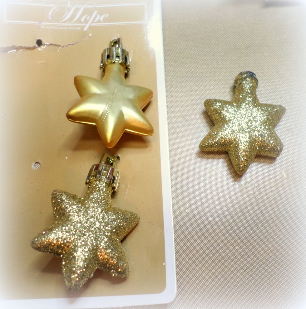 I got these little star ornaments at the Dollar Store. I used pliers to remove the hanging part of the ornament.