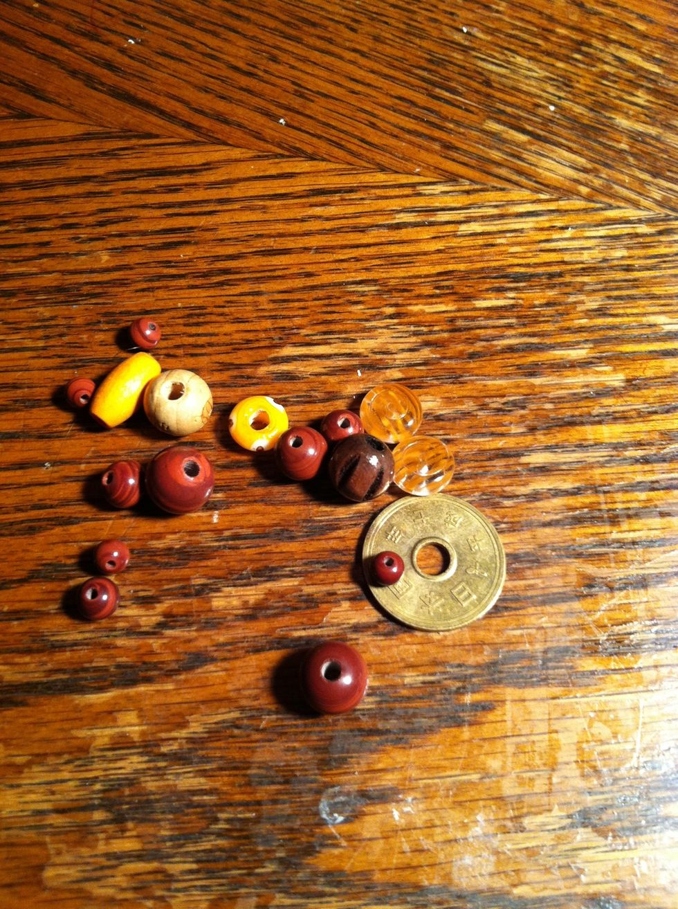 I grabbed a pretty random assortment of beads and a coin with a hole in it. That will be my center piece. I may paint it first so I'm going to add my beads before I decide.