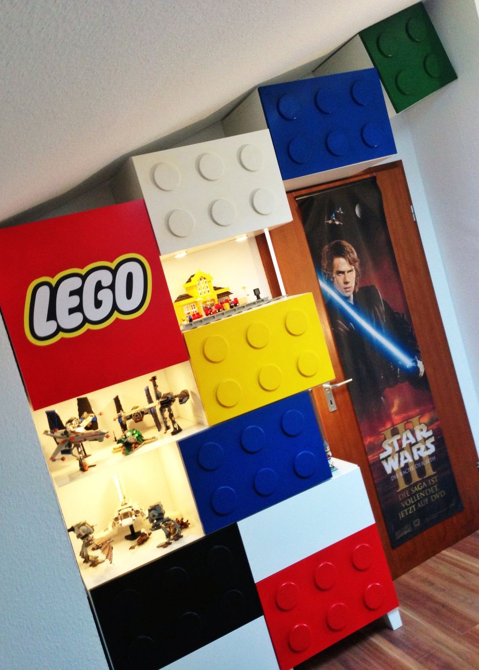 I had a LEGO logo printed on adhesive foil and attached it to the door.