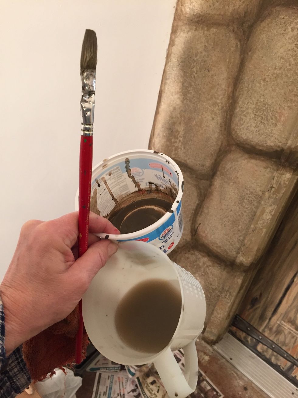 I had dark brown in a plastic bowl and water in the other. Use a combination of straight paint, watery paint and dry brush shaping the stones.