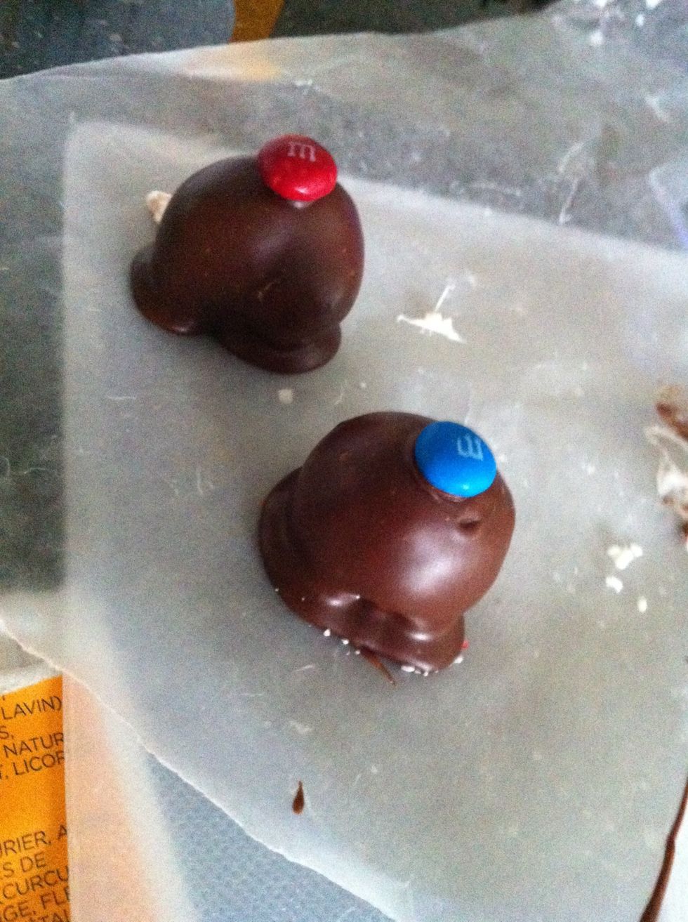 I had some extra chocolate so I put some m&ms in some caramel balls and coated them in choco