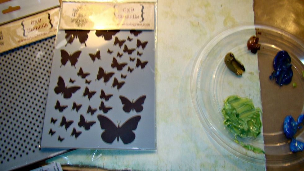 I had this green paper forever and decided to change it up using my AA stencils and some velvet paints which are dimensional so they work great with stencils. Randomly add your paint to your paper.