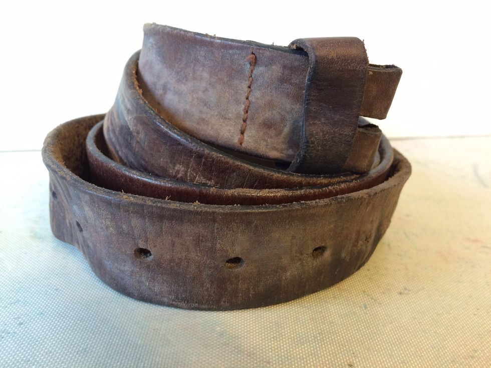 I had this old belt laying around.  I've hung onto it with the intentions of making bracelets out of it.  And, you know what?  Today is the day!