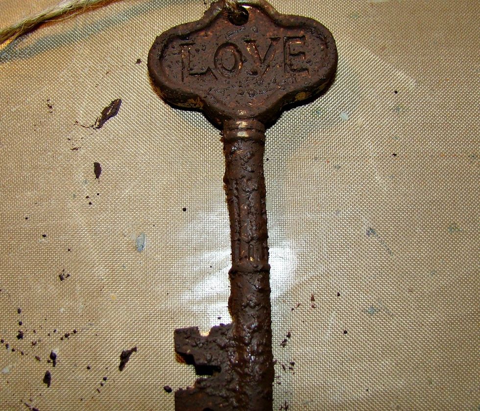 I had this plastic key I purchased from Michaels for $1.50 and gave it a nice coat of the dark brown textured medium. Dry completely. Then add your terracotta mixture over the top and dry.