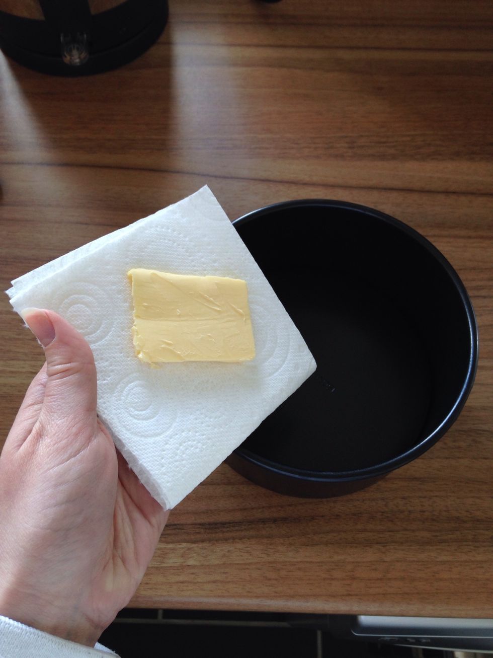 I hate greasy fingers after preparing tins for baking. I put a bit of butter on a piece of strong kitchen towel and grease the sides and bottom of the tin.