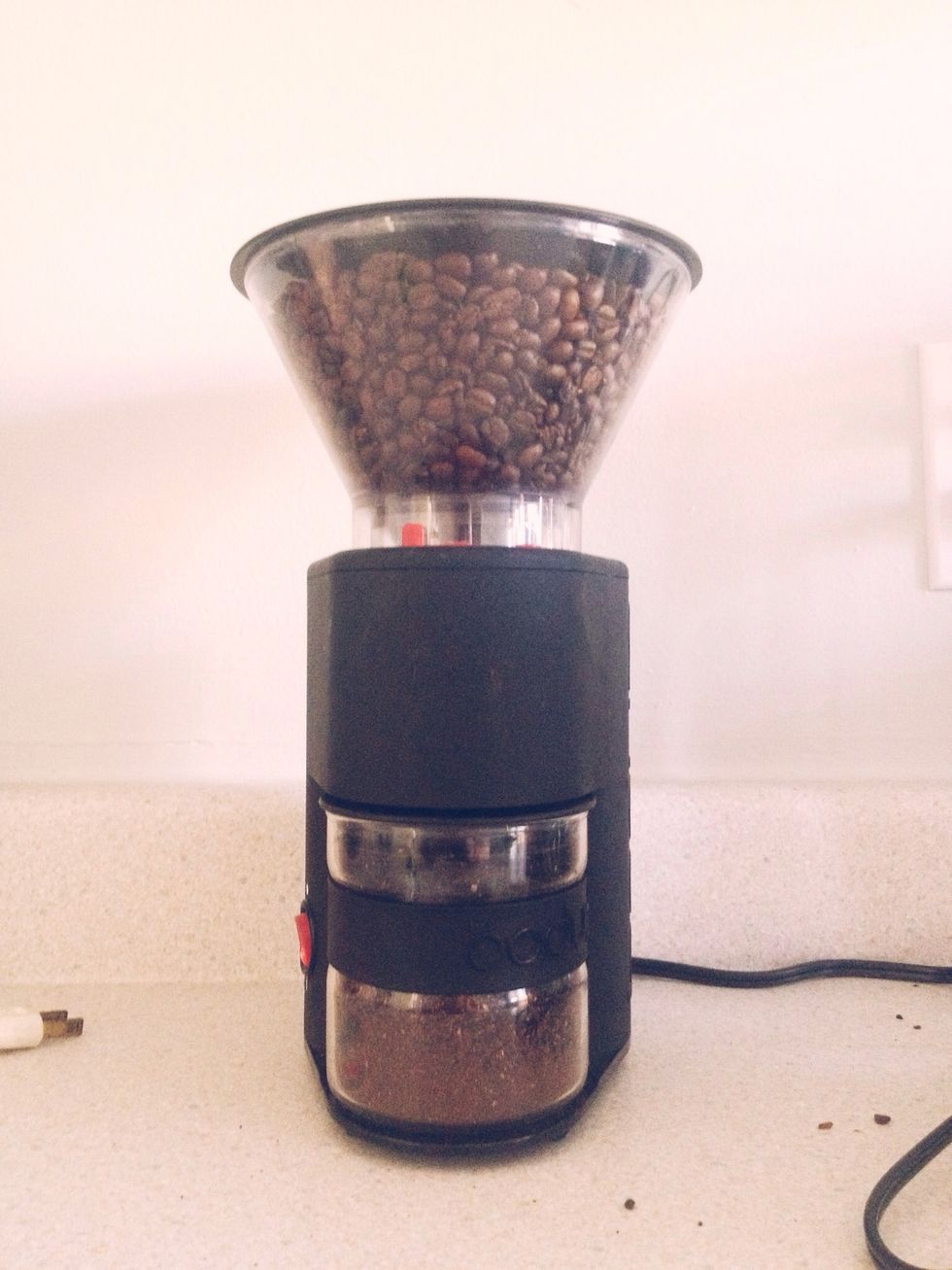 I have a Bodum Burr Grinder, but you can use an electric blade grinder. I have a friend who used a boulder and a stone to grind his brew near his fire tower in Northern Alberta.