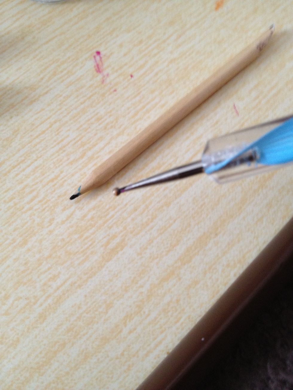 I have a dotting tool (cheap on a well known auction site) or a tooth pick.