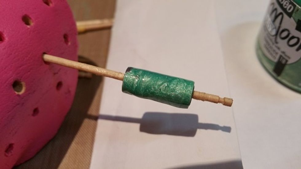 I have covered a tube paper bead with Emerald Prisme Fantasy. This paint is enamel based so I apply it with toothpicks rather than a brush. It also takes a while to dry. I leave items to dry overnight