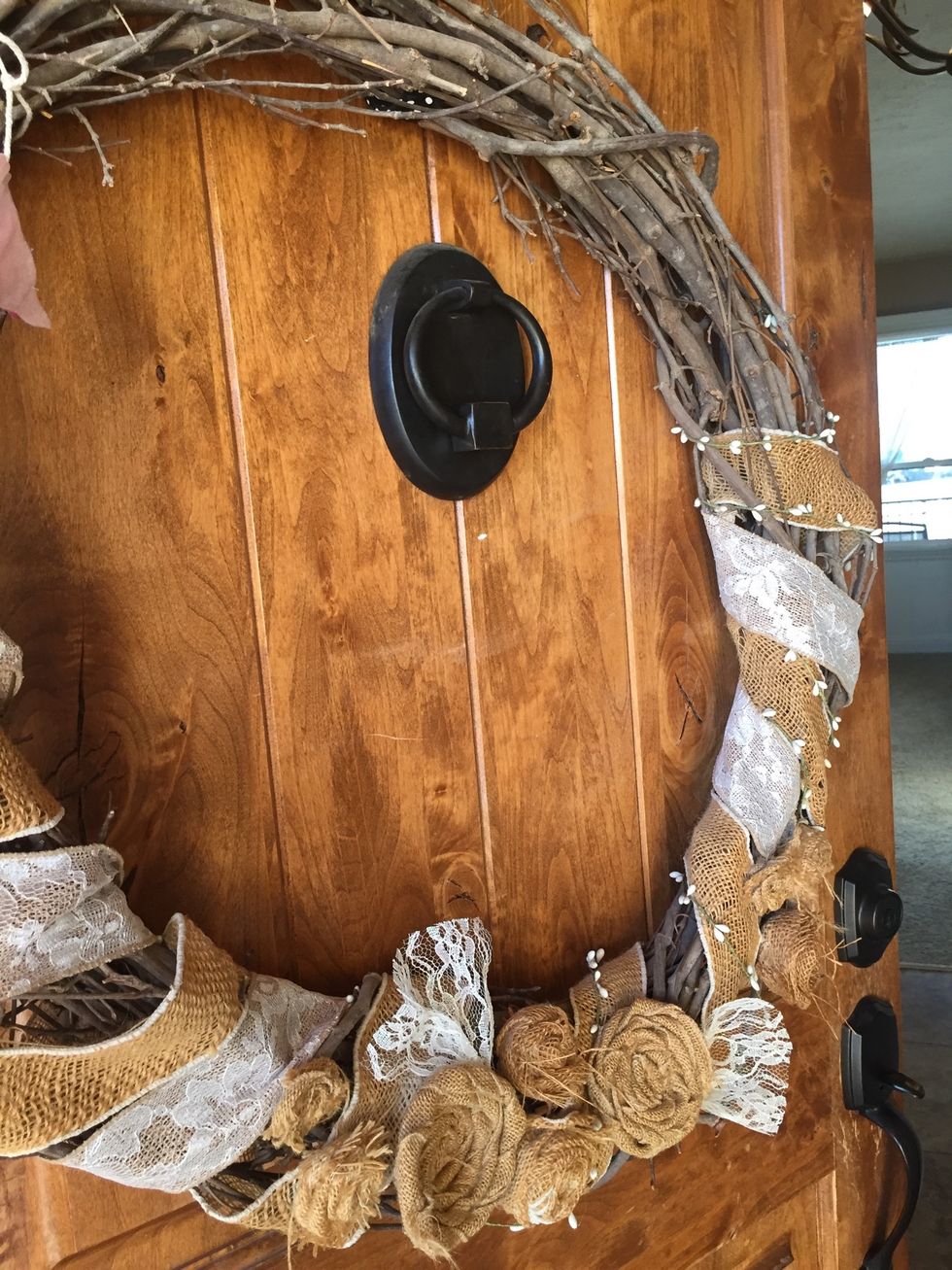 I have had this wreath for awhile. It's pretty basic and neutral, but I like that. Although around the holidays I want something for my door, but don't want to store a wreath for every holiday.