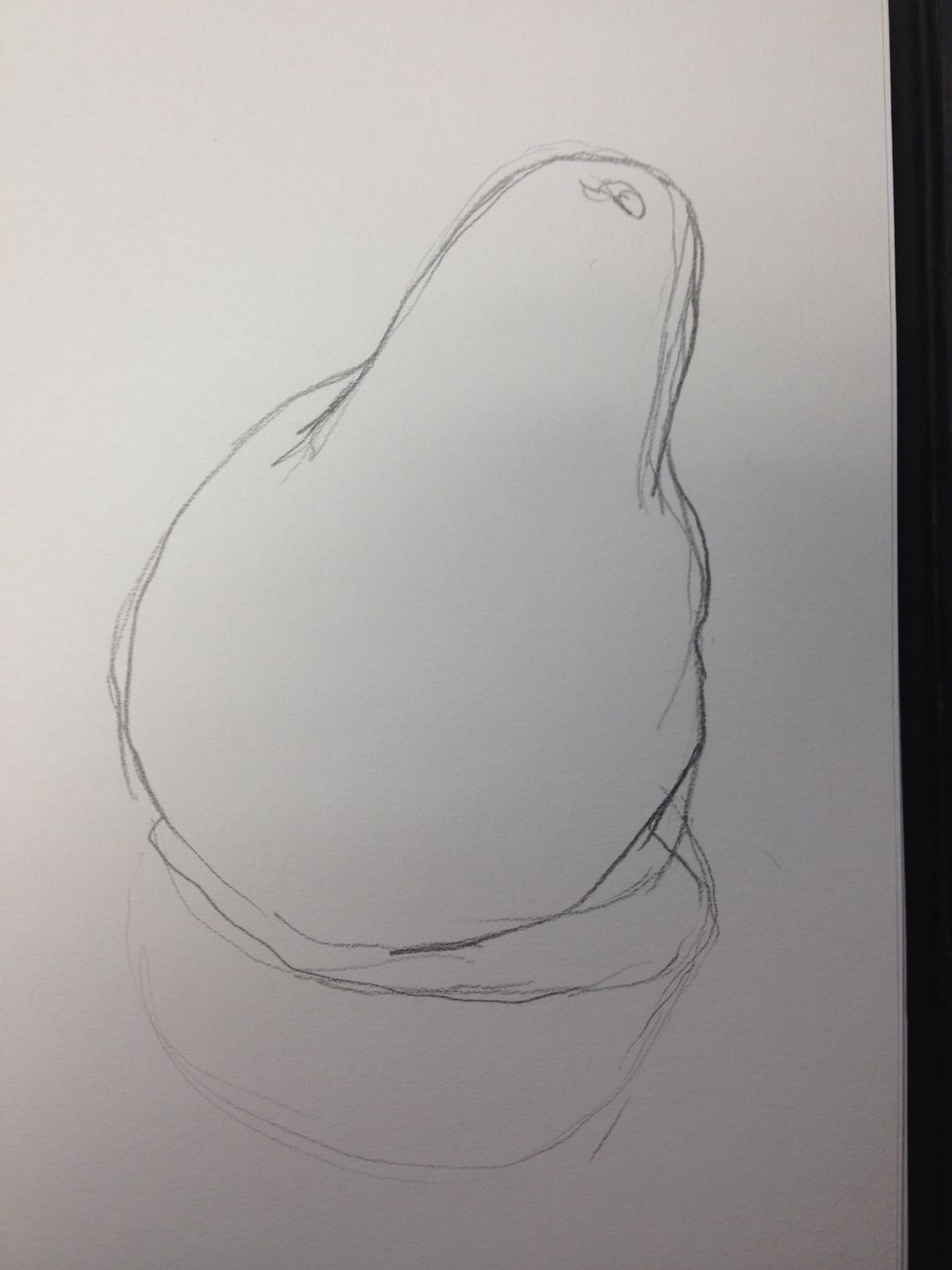 I have my drawing of the pear including the umbra and penumbra. Concentrate on careful observation of the lumps and bumps, the tilt and any other detail but remember, we are not cameras.