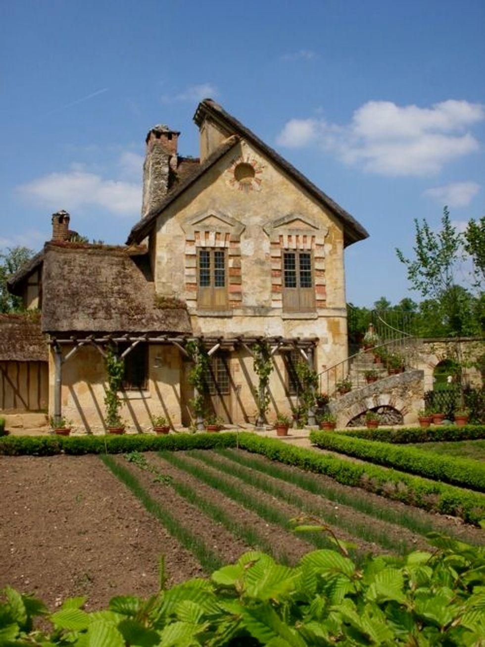 I have spent hours with this photo of Marie Antoinett's Le Petit Trianon. I love the crumbling brick and stone, the details around the windows, and the wonderful roofs.