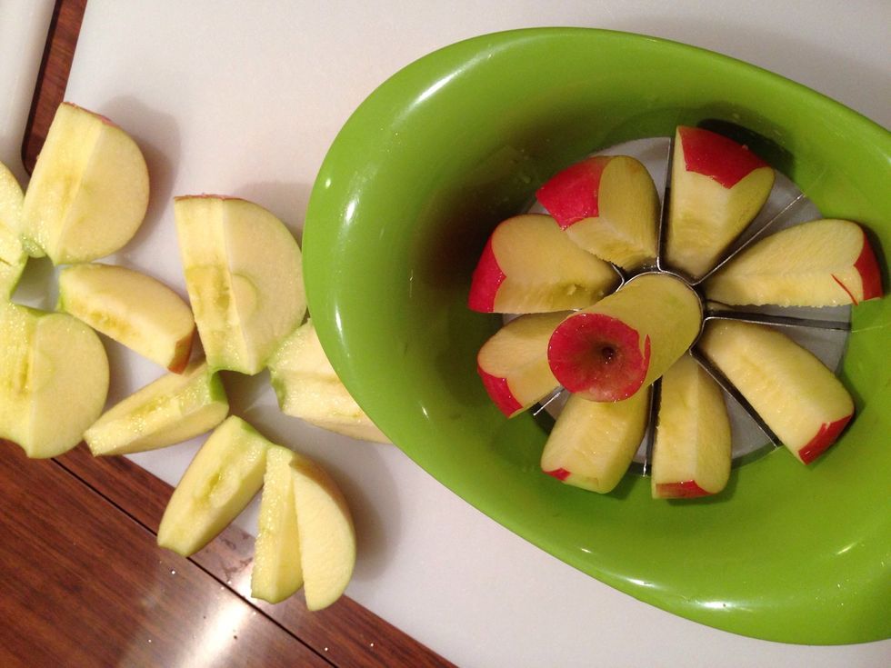 I have this handy little apple slicer from ikea. It's amazing. Do not cut apples without one! Remove any seeds and rough center parts. Add your cut apple slices to the pot. Skins are fine to add!!