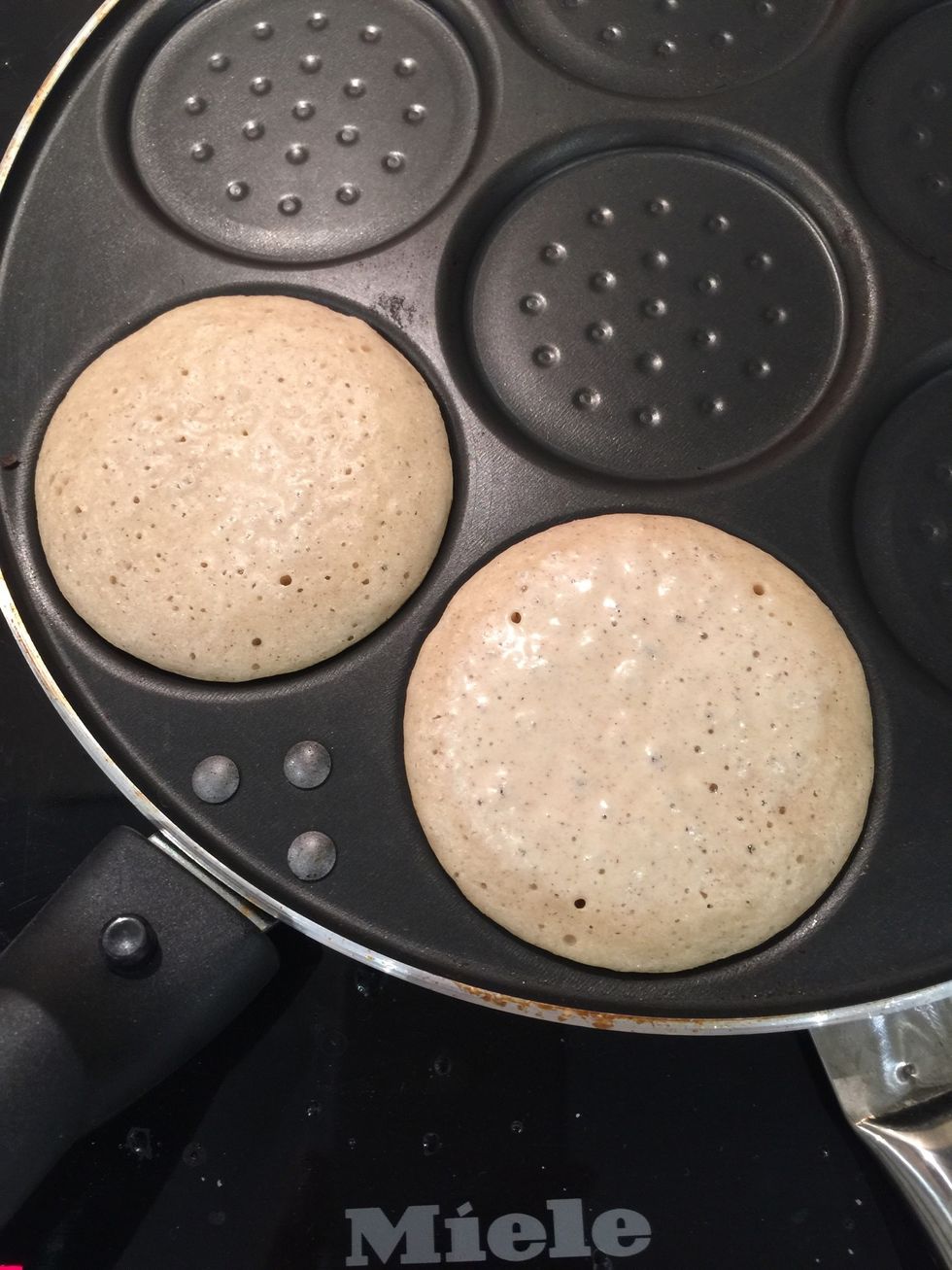I have this special pan for oladiya(small blini) heat your pan on medium low and cook the Oladie 2 mins on each side