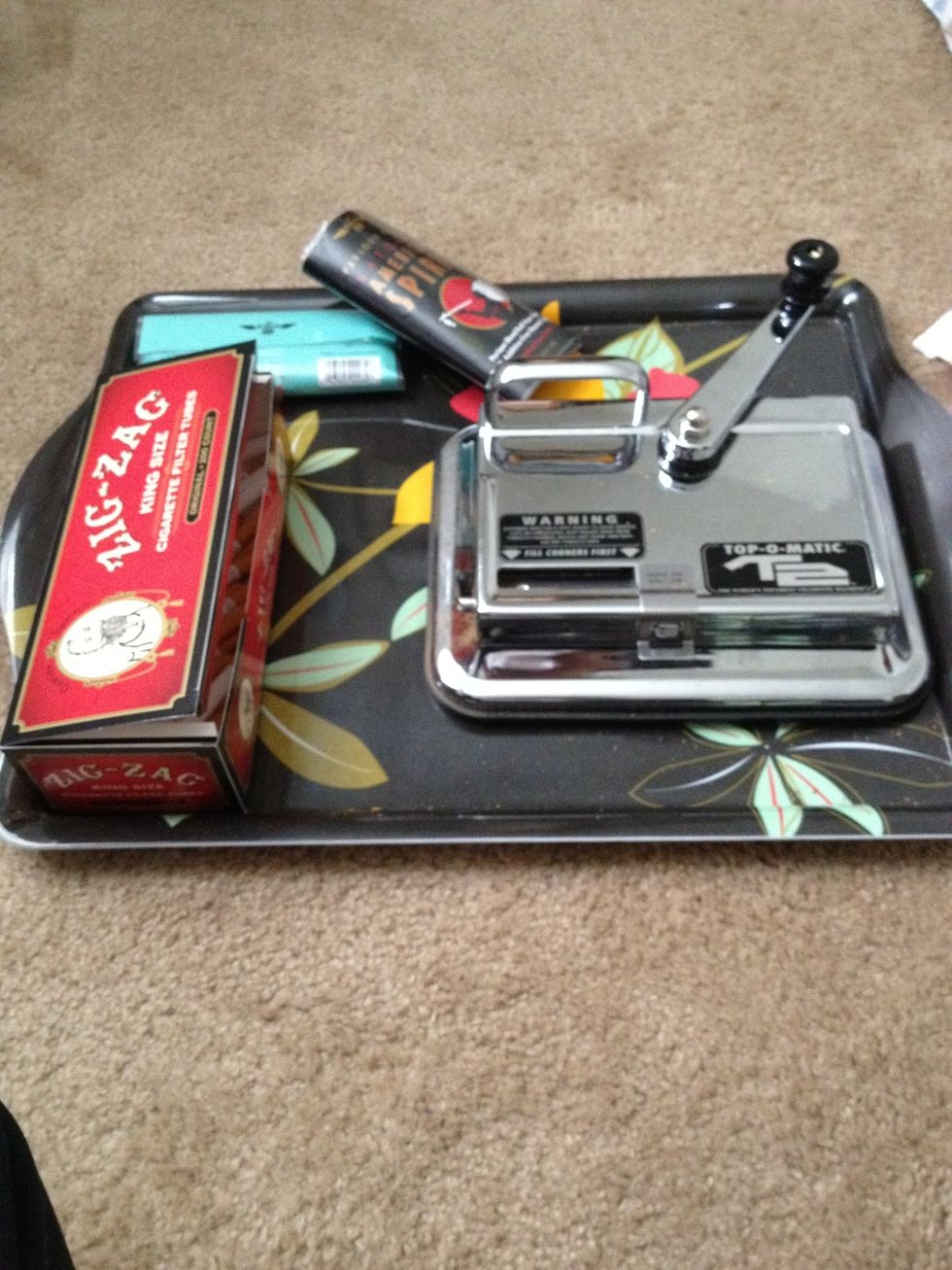 I highly highlyyy recommend you buy a tray for the machine. Without one you will have tobacco everywhere no matter were you roll.