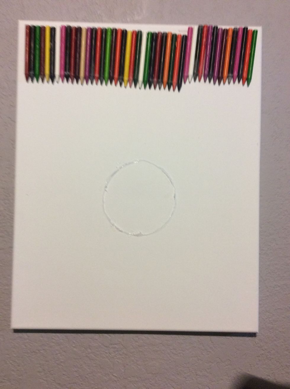 I hot glued around the object (you have to have more then one layer otherwise the crayons will go right over the glue)