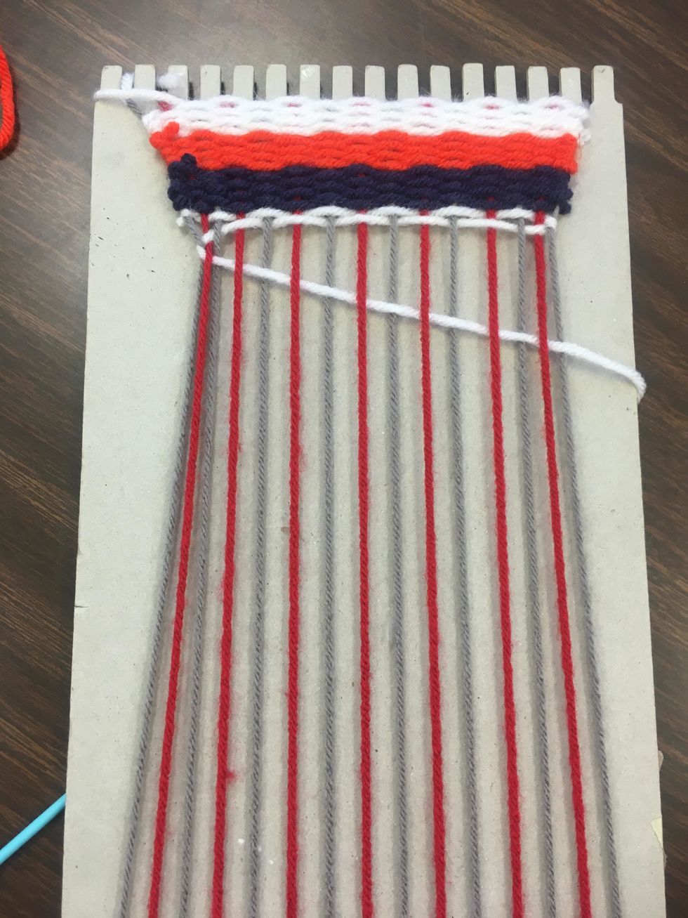 I jumped back to white. You can choose any color pattern you wish with this. You can go all the way down the cardboard, or just a short weave.